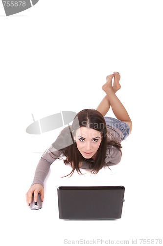 Image of casual woman with a laptop, working on the floor.