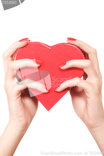 Image of Woman holding red heart in the hand