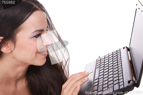 Image of casual woman with a laptop, working on the floor.