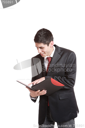 Image of Confident businessman with notebook