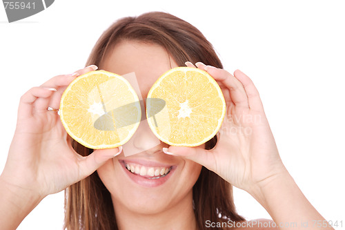 Image of happy model eating an orange