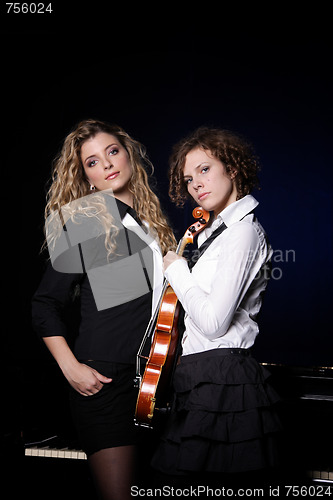 Image of Two beautiful young women with violon and piano