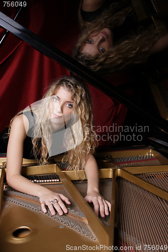 Image of woman playing piano