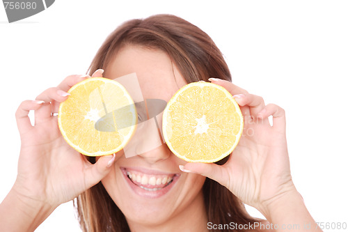 Image of happy model eating an orange