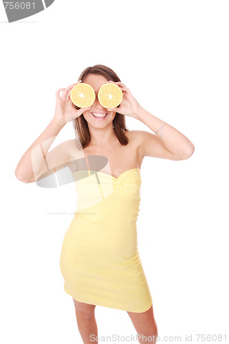Image of happy model eating an orange