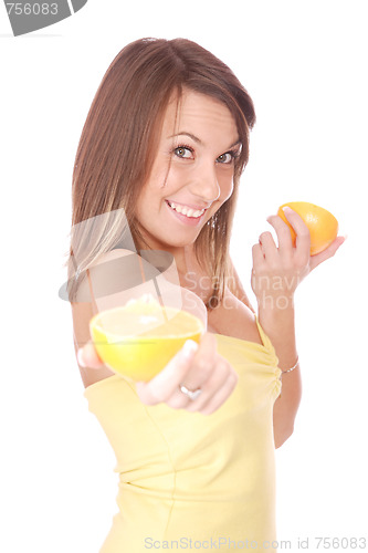 Image of happy model eating an orange
