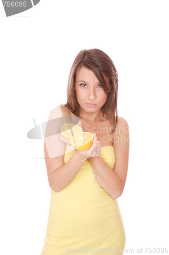 Image of happy model eating an orange