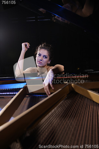 Image of woman playing piano