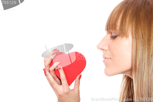 Image of Woman holding red heart in the hand