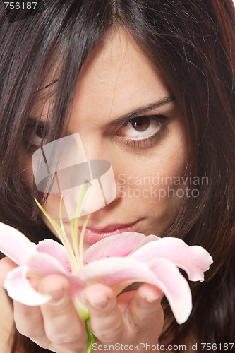 Image of Beautiful woman with flower isolated on white