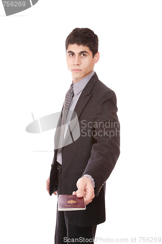 Image of  A businessman in a suit holds passport