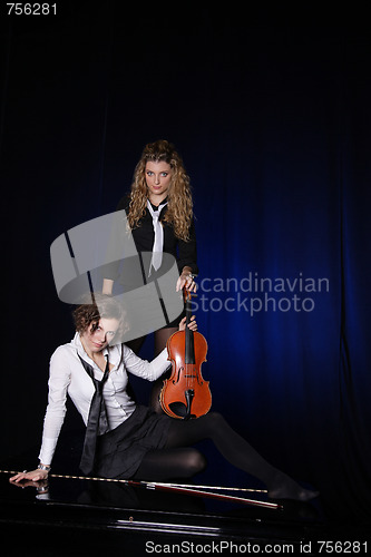 Image of Two beautiful young women with violon and piano