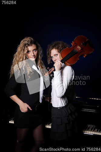 Image of Two beautiful young women with violon and piano