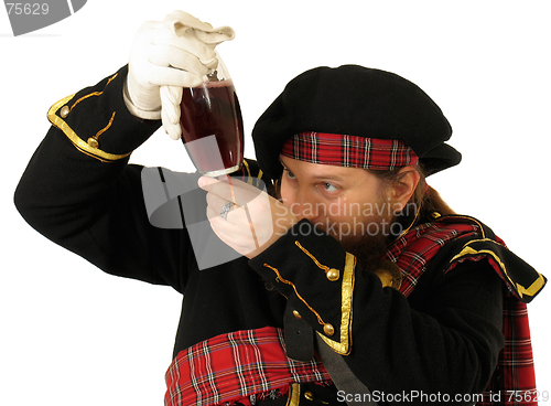 Image of Scottish warrior with the bottle of red wine