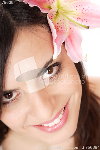 Image of Beautiful woman with flower isolated on white