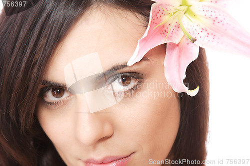 Image of Beautiful woman with flower isolated on white
