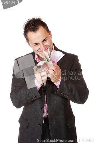 Image of Portrait of a business man holding money 