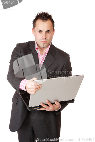 Image of Happy businessman holding laptop computer