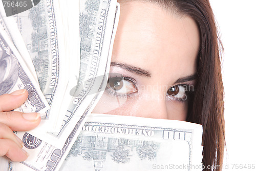 Image of Attractive woman takes lot of 100 dollar bills