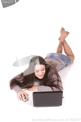 Image of casual woman with a laptop, working on the floor.