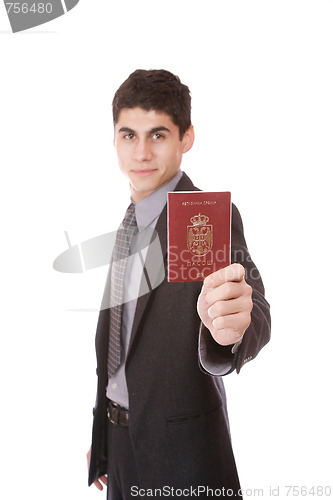 Image of  A businessman in a suit holds passport