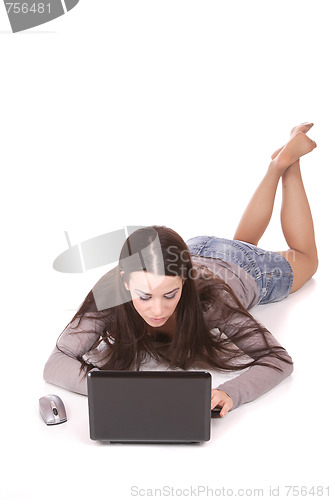 Image of casual woman with a laptop, working on the floor.