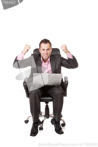 Image of Relaxed young businessman, sitting on a chair.