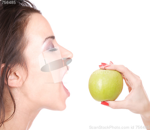 Image of A pretty young woman holding an apple 