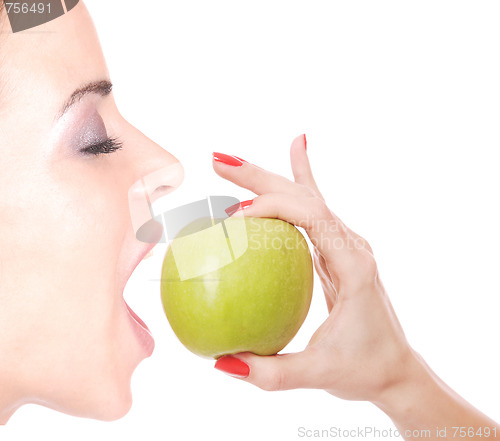 Image of A pretty young woman holding an apple 