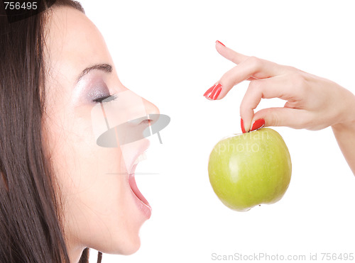 Image of A pretty young woman holding an apple 