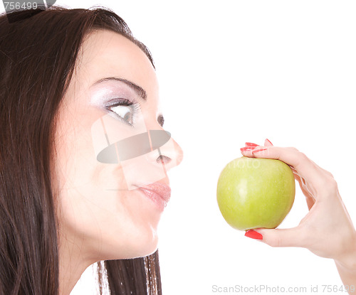 Image of A pretty young woman holding an apple 