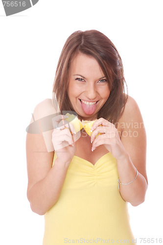 Image of happy model eating a Lemon