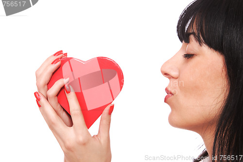 Image of Woman holding red heart in the hand