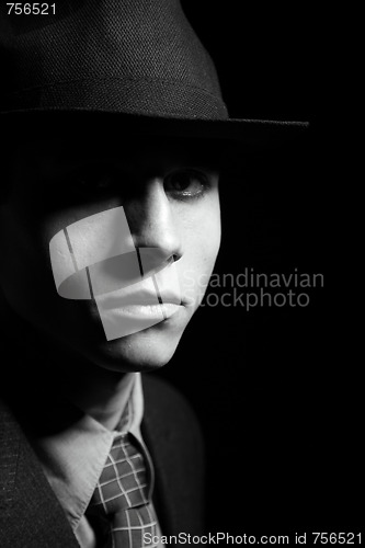 Image of a man in a grey hat