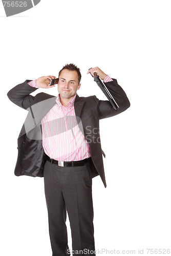 Image of Happy businessman holding laptop computer