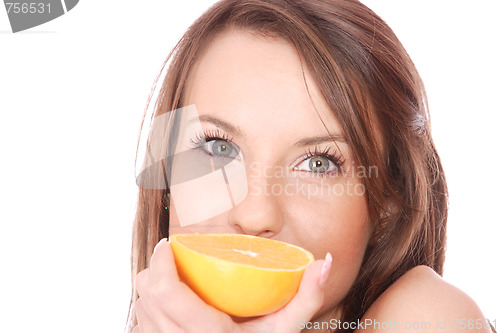 Image of happy model eating an orange