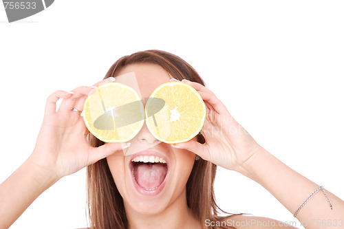 Image of happy model eating an orange