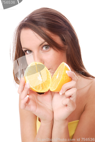 Image of happy model eating an orange