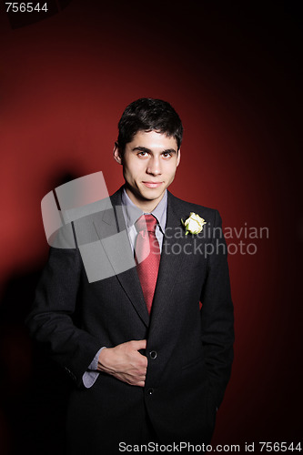 Image of  Young happy smiling handsome man with rose