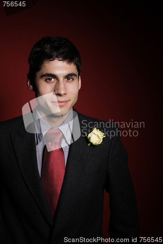 Image of  Young happy smiling handsome man with rose