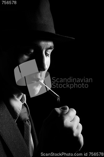 Image of a man in a grey hat