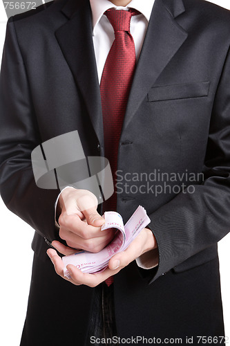 Image of Portrait of a business man holding money 