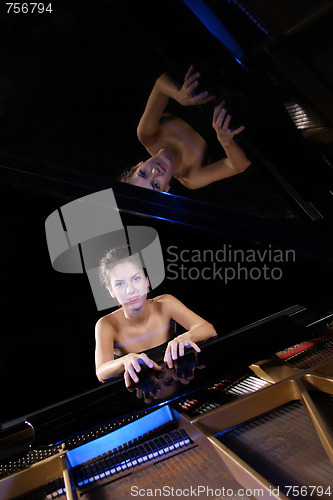 Image of woman playing piano