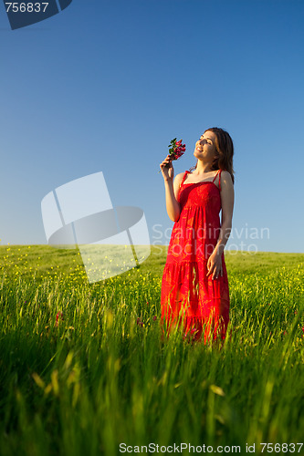 Image of Happy woman with flowers