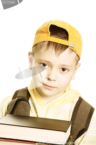 Image of Schoolboy with books closeup