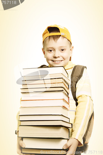 Image of Smiling schoolboy with books