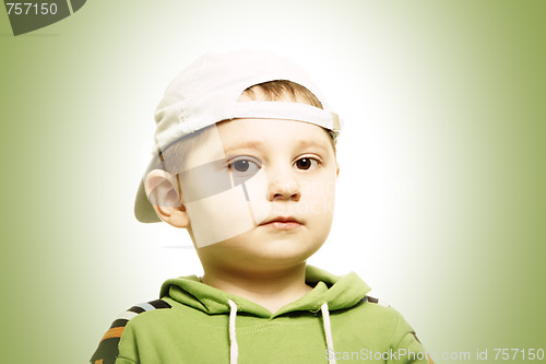 Image of Serious boy in green