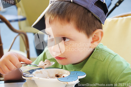 Image of Boy eats ice-cream