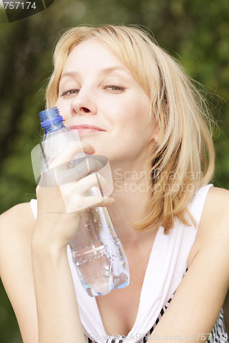 Image of Smiling blonde with bottle of water