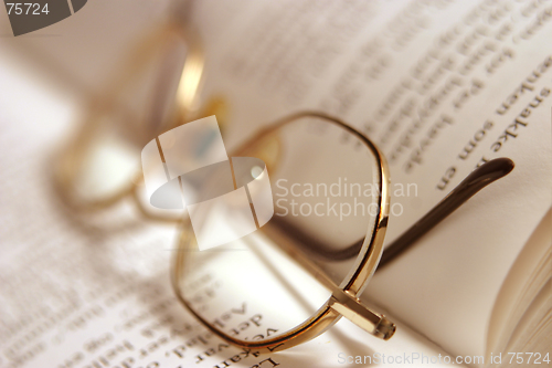 Image of book, glasses